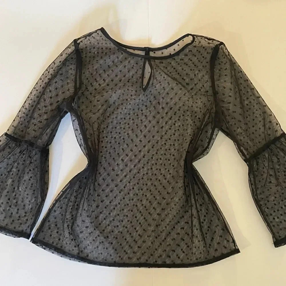 Cute sheer polka dot detail blouse with bell sleeves. Size S